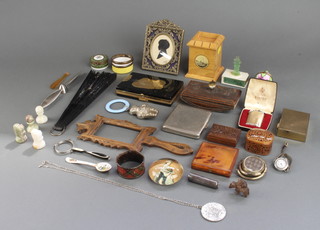 A carved wooden desk blotter and minor curios 
