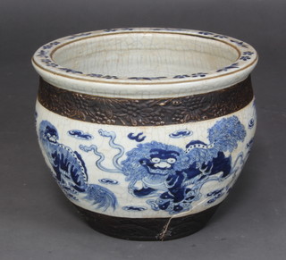 A Chinese 20th Century blue and white crackle glazed jardiniere decorated shi-shi with metal banding embossed chrysanthemums (large star crack to base)