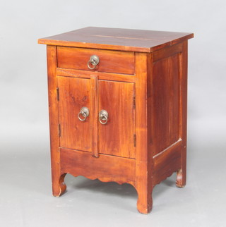 A Chinese hardwood bedside cabinet fitted a drawer above a cupboard enclosed by a pair of panelled doors 66cm h x 50cm w x 40 cm d