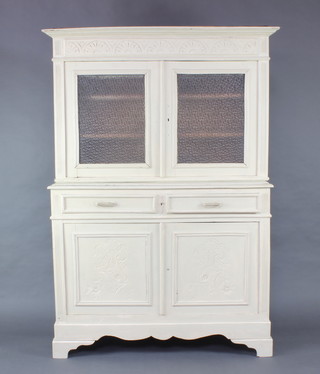 A Continental grey painted pine dresser with moulded cornice, fitted shelves enclosed by frosted glazed panelled doors, the base fitted 2 long drawers above a cupboard enclosed by a pair of carved panelled doors 186cm h x 127cm w x 46cm d 