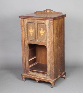 A Victorian inlaid rosewood music cabinet with raised back enclosed by a panelled door 102cm h x 54cm w x 38cm d (glass panel to the front missing and 1 caster is missing) 