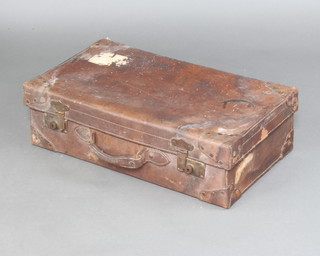 A 1930's leather suitcase with brass fittings 18cm h x 61cm w x 35cm 