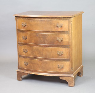 A Georgian style walnut bow front chest of 4 drawers raised on bracket feet 77cm h x 69cm w x 47cm d 