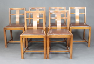 A set of 6 1930's oak slat and rail back chairs with upholstered drop in seats