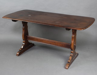 An Ercol dark elm refectory dining table raised on standard end supports with H framed stretcher 73cm h x 151cm l x 79cm w 