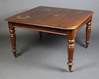 A Victorian mahogany extending dining table with 1 extra leaf, raised on turned and fluted supports 71cm h x 117cm l x 150cm w 