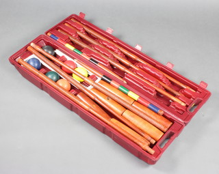 A Franklin professional croquet set comprising 6 mallets, 6 balls and 6 hoops contained in a plastic carrying case 