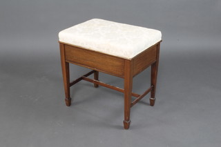 An Edwardian inlaid mahogany box seat piano stool with upholstered hinged lid, raised on square tapered supports with H framed stretcher 51cm x 50cm x 36cm 