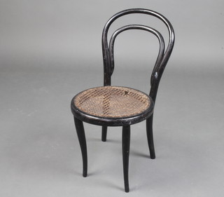 A child's Edwardian ebonised bentwood chair with woven rush seat 63cm x 30cm diam 
