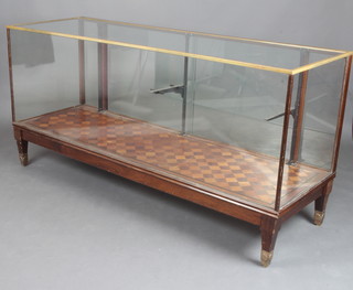 An Art Deco bronze finished and mahogany shop display cabinet raised on square tapered supports 89cm h x 183cm w x 61cm d 
