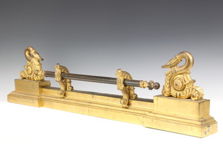 A Regency gilt metal and bronze fire curb decorated swans 22cm h x 95cm w x 8cm d 