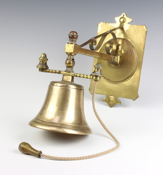 An Art Nouveau brass hanging monastery style bell complete with bracket  25cm x 23cm 