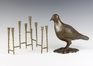 A bronze figure of a standing pigeon on an oval naturalistic base  21cm x 9cm together with a mid 20th Century Continental bronze candelabrum 20cm 23cm x 5cm  