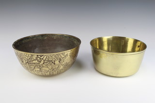 A circular Japanese polished bronze bowl, the body decorated figures of Samurai and with seal mark to the base 12cm x 26cm diam. and a circular polished brass bowl 11cm x 22cm and 11cm x 26cm 