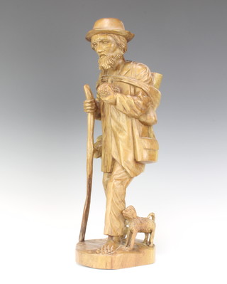 A carved wooden figure of a standing shepherd 46cm x 14cm x 15cm 