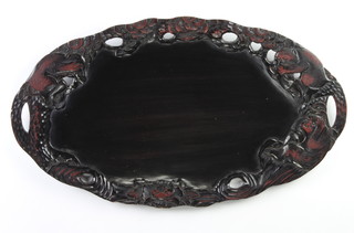 An oval Japanese lacquered carved and pierced hardwood twin handled tray decorated the three wise monkeys 61cm x 36cm

