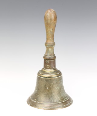 A 19th Century brass hand bell with turned wooden handle and replacement clapper 