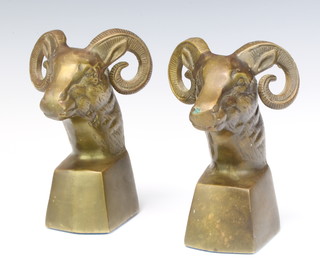 A pair of bronze bookends in the form of rams masks 15cm x 7cm x 7cm 