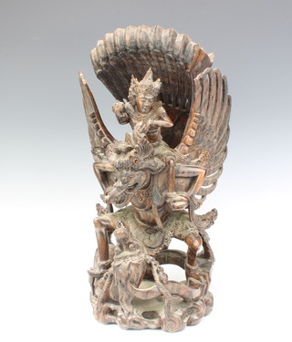 An Eastern carved and pierced hardwood figure of a mythical beast/deity 40cm x 17cm x 17cm 