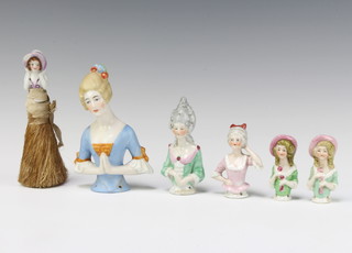 A pin doll 9.5cm, 4 others and a brush ditto 