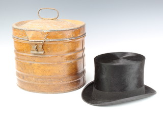 A gentleman's black silk top hat, size 7, together with a pressed metal hat box 