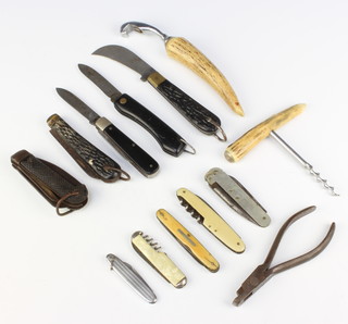 A SPA military issue jack knife blade, tin opener and merlin spike, the blade with arrow dated 1941, a girl guide pocket knife with blade and merlin spike, folding pocket knife with horn grip, a pruning knife with simulated horn grip, a 2 bladed folding pocket knife blade marked Sheffield, a folding pocket knife, 3 pen knives, a ticket punch, a stag horn handled corkscrew and matching bottle opener