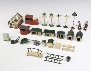A Britains model greenhouse, 2 ditto kennels, 2 rabbit hutches (1f), 2 beehives, forge with anvil and 2 blacksmiths, 2 dovecotes, 2 cattle troughs, 2 finger sign posts, bridge, wheelbarrow, lawnmower, mile stone, hutch, 2 ladders, well, chickens nest and sign 
