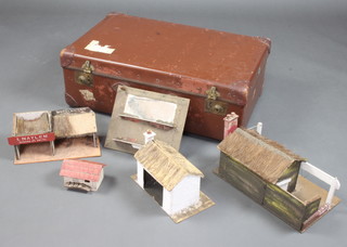 A fibre suitcase containing a collection of various wooden farm buildings 
