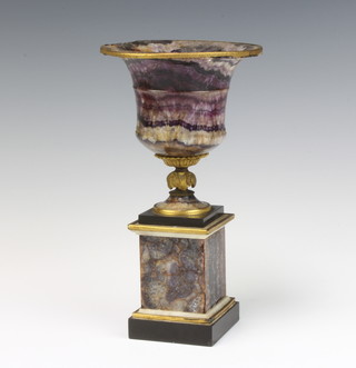 A Blue John urn of campanula form raised on a square base with gilt metal mounts 24cm x 13cm 