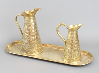 A Sankey and Sankey brass embossed snake pattern 2 handled tray 60cm x 22cm and 2 ditto graduated jugs 30cm x 15cm and 23cm x 30cm, 1 with Neptune mark to the base  