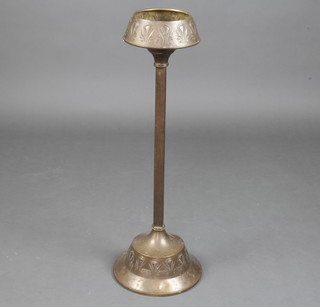 An Art Nouveau circular embossed gilt metal pedestal ashtray raised on a square reeded column with circular spreading foot 73cm h x 14cm diam. (no ashtray)  