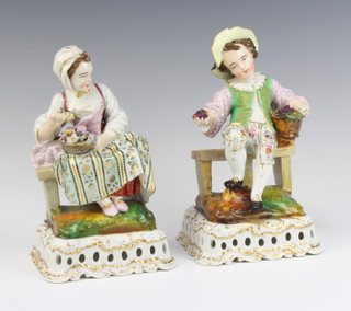 A pair of 19th Century German porcelain figures of a seated lady and gentleman raised on pierced bases 21cm 