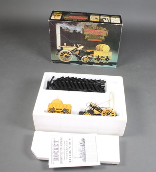A Hornby Stephenson's Rocket Real Steam 3 1/2" gauge train set, comprising locomotive and tender, boxed together with a carriage and a quantity of rails 