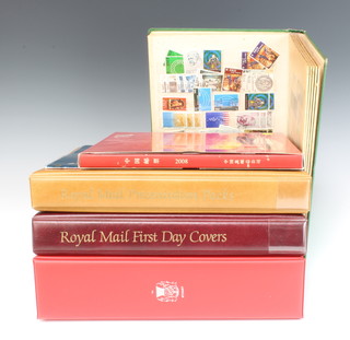 A stock book of world stamps, 3 albums of GB first day covers, 3 pages of mint Elizabeth II GB stamps, album of Chinese stamps 