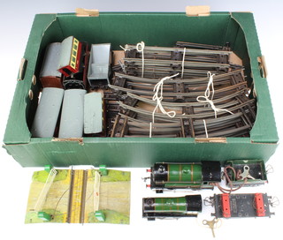 A Hornby Meccano O gauge type 51 locomotive and tender complete with key and a Meccano type 20 locomotive, 3 carriages (1 with lid f) and a collection of rolling stock and rails