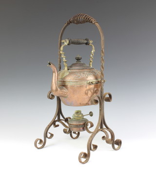 A Victorian embossed copper tea kettle raised on an iron stand complete with burner 45cm h x 21cm w x 20cm d 