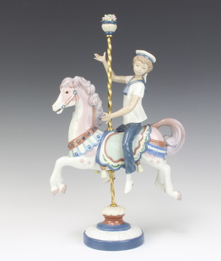 A Lladro figure of a boy on carousel horse no.1470 40cm 