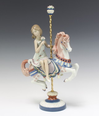 A Lladro figure of a girl on a carousel horse no.1469 40cm 