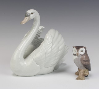 A Lladro figure of a swan 5231 18cm and a ditto of an owl sitting on a branch 9cm 