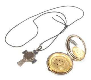 A silver compact together with a coin pendant 