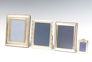 A rectangular silver photograph frame 18cm Sheffield 1990 and 3 others