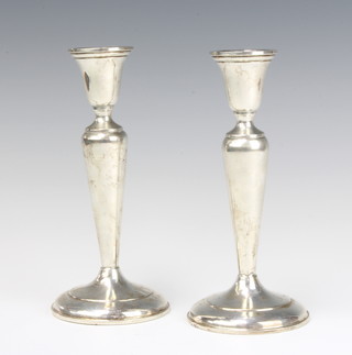A pair of Cartier sterling silver tapered candlesticks 18.5cm 
