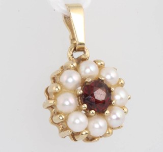 A 9ct yellow gold garnet and pearl pendant 15mm 
