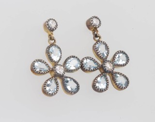 A pair of gilt earrings, the flower heads set with topaz and diamonds 12mm 