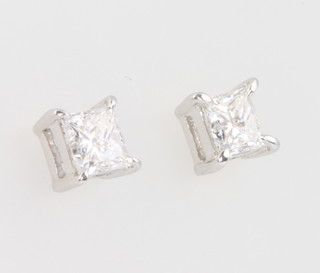A pair of 18ct white gold princess cut diamond ear studs, total weight 0.7ct 