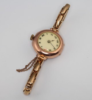 A lady's 9ct yellow gold wristwatch on a ditto expanding bracelet, gross 27 grams