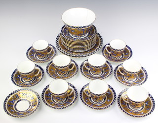 An Edwardian Coalport Secessionist part tea set comprising 9 tea cups, 10 saucers, 10 sandwich plates, 2 cake plates and a slop bowl 