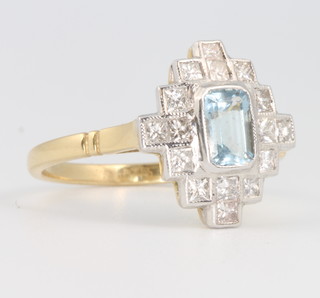 An 18ct yellow gold aquamarine and diamond ring, the rectangular cut centre stone approx. 0.65ct surrounded by 16 brilliant cut diamonds size P  