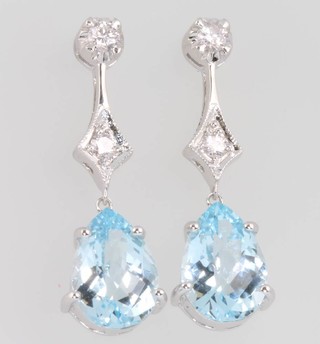 A pair of 18ct white gold pear cut topaz and diamond ear drops, the topaz 7.75ct, the diamonds 0.36ct 31mm 