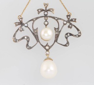 A gilt Edwardian style pearl and diamond pendant and chain 